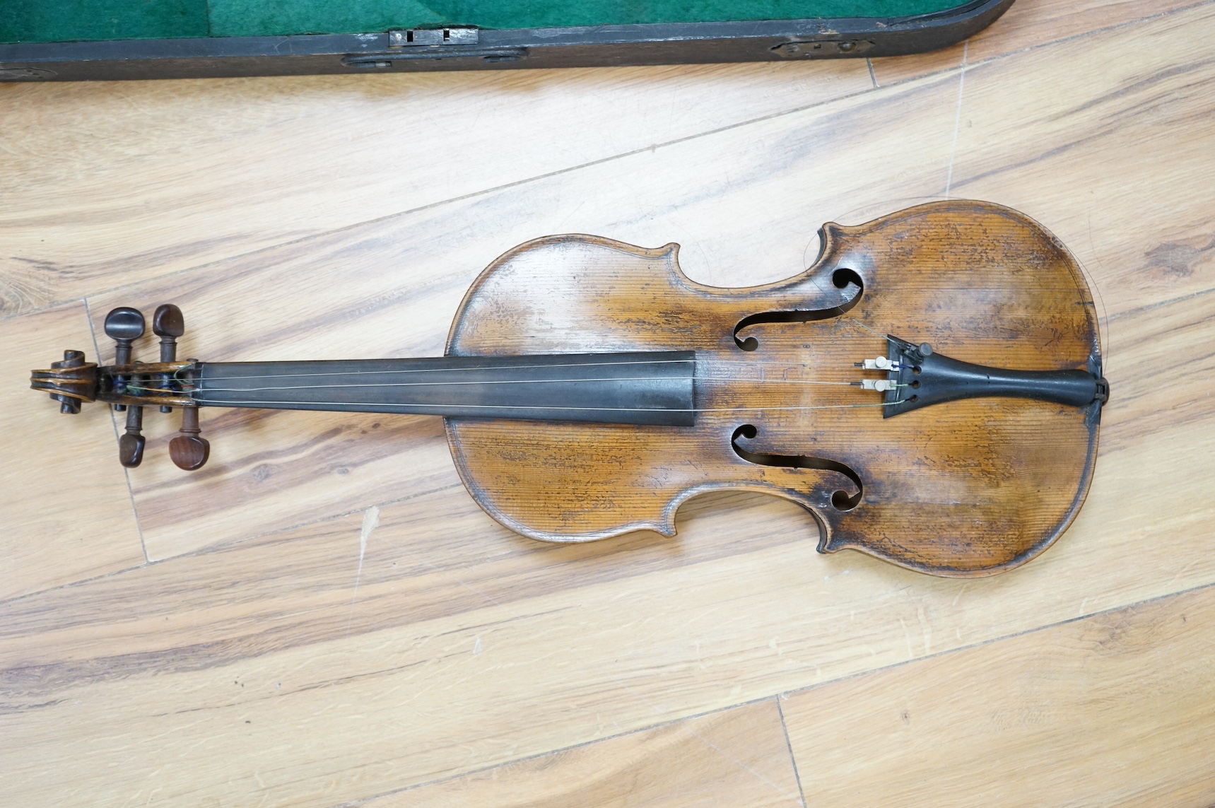 A cased 19th century French violin, back, 36cm. Condition - fair